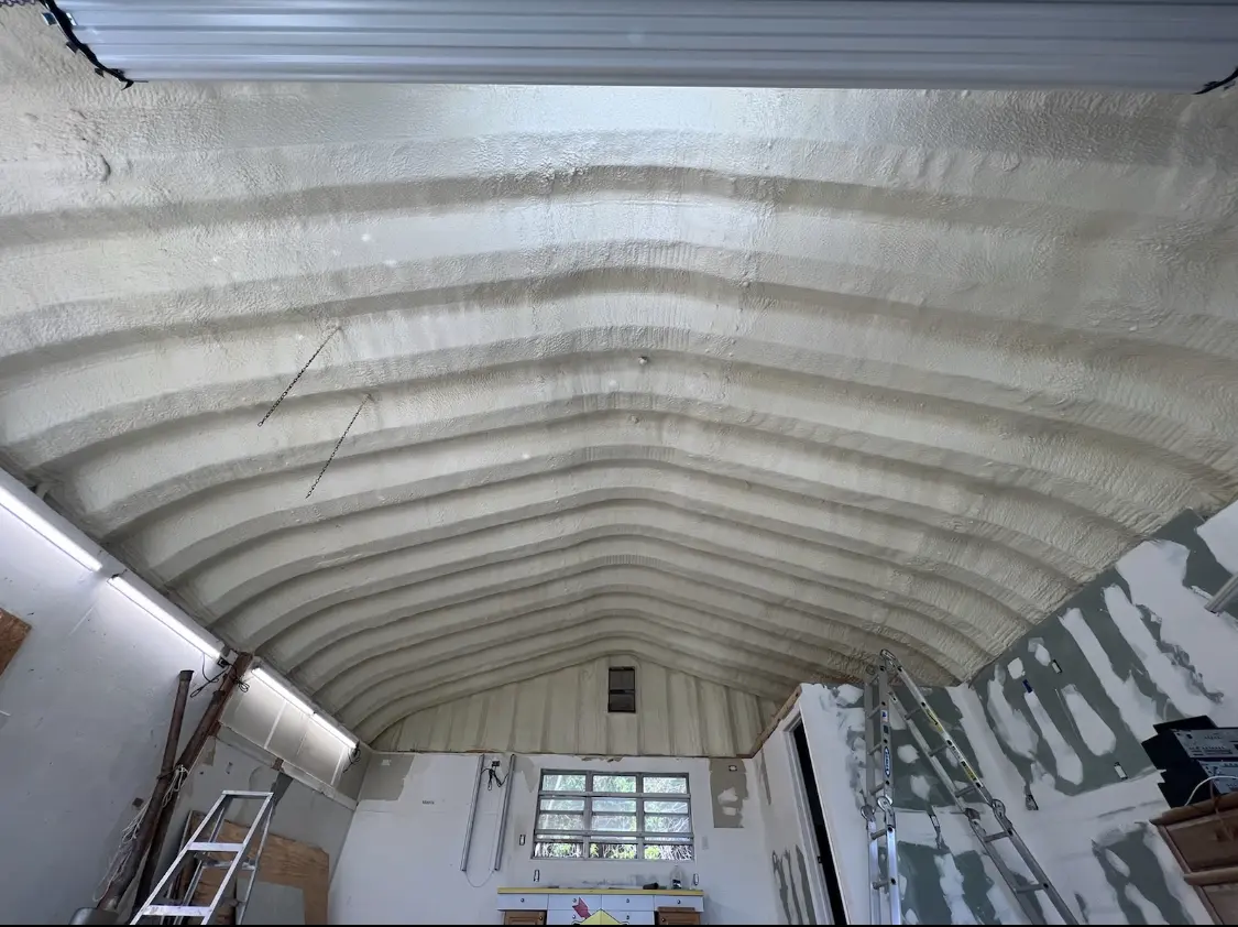 Spray polyurethane foam applied to the underside of a metal roof deck in Belterra